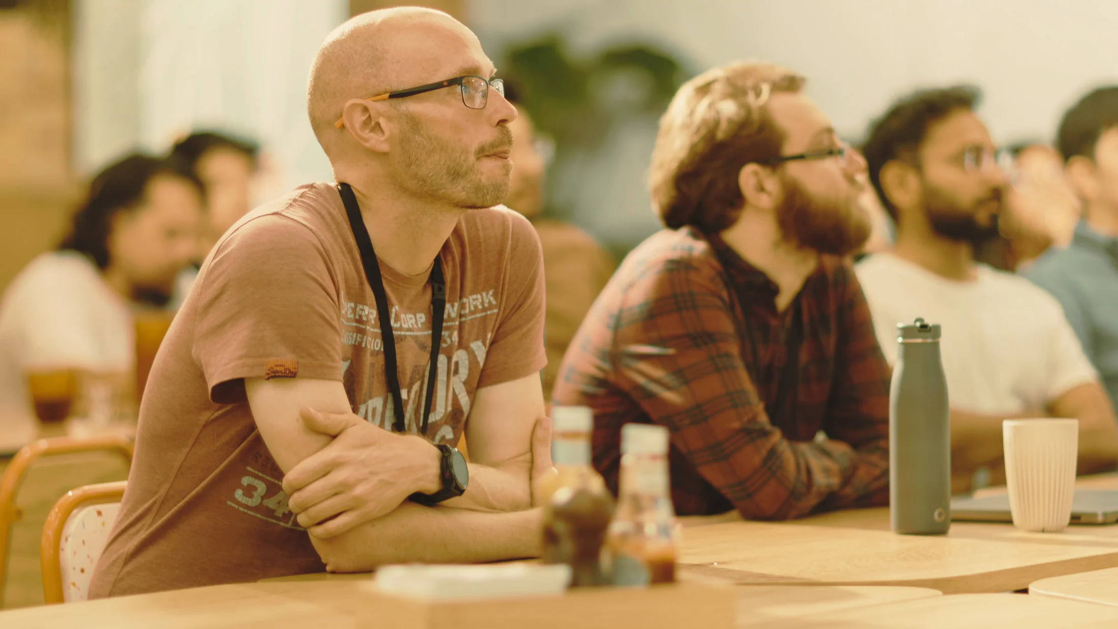 Professionals listening and connecting at a business networking event.